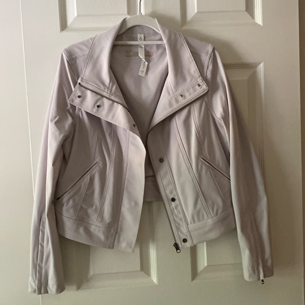 Lululemon cropped, stretchy biker jacket with pockets.